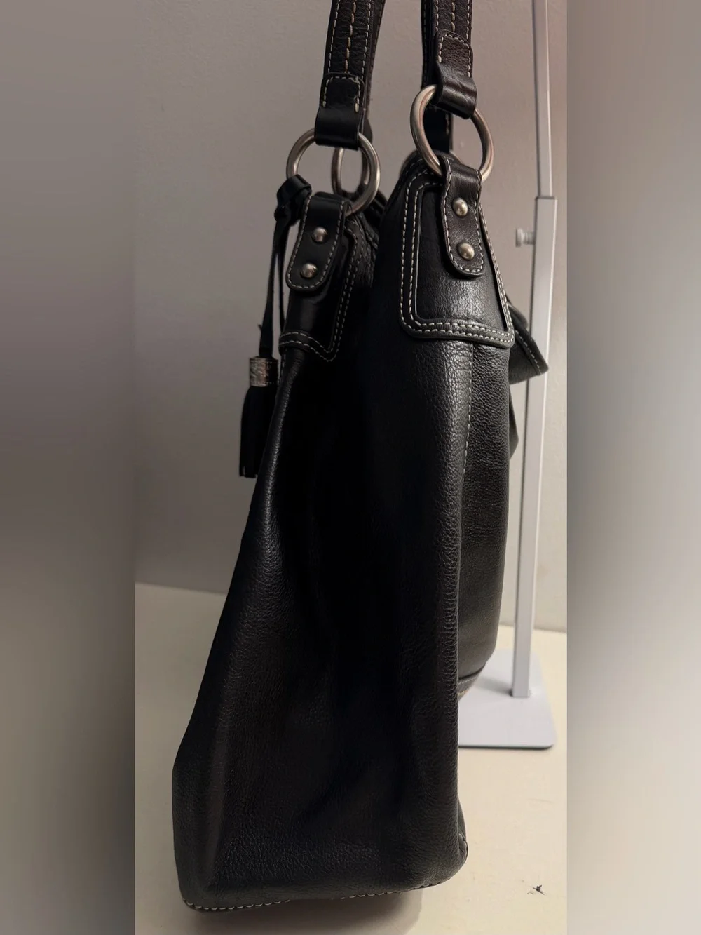 The Sak “PO Asbury” large pebbled black leather hobo/shoulder bag.